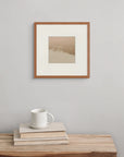 Framed above a wooden bench with a book and cup, “Autumn Breath” evokes the cool clarity and soft light of an autumn day.